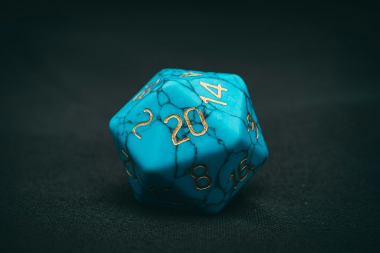 photo of blue 20 sided dice d20 game dice